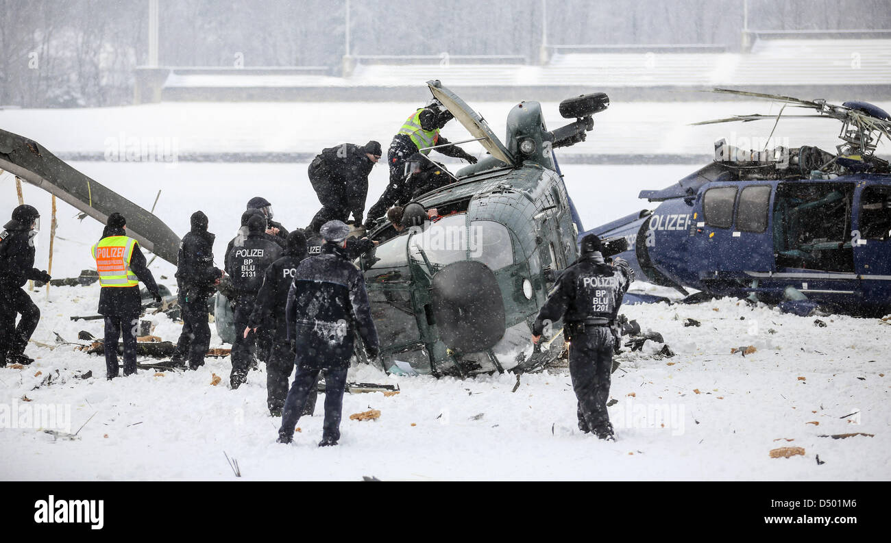 Berlin, Germany. 21 March 2013. Two crashed helicopters of the German federal police lie on the May field at the Olympic Stadium in Berlin.  During an exercise of the federal police the two helicopters collided as they approached for landing. Photo: HANNIBAL/DPA/Alamy Live News Stock Photo