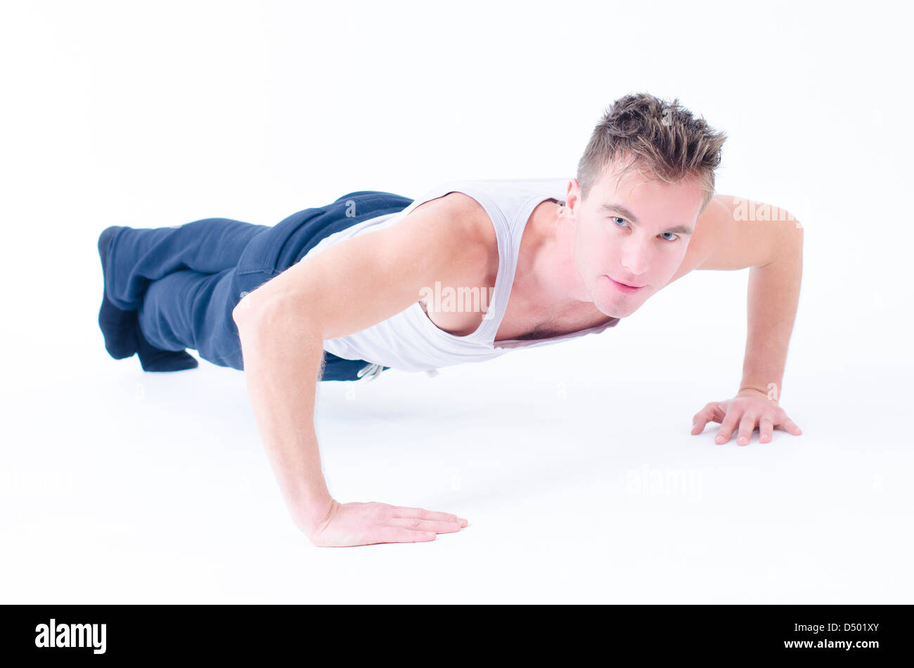 Sportive man doing push up isolated on white Stock Photo - Alamy