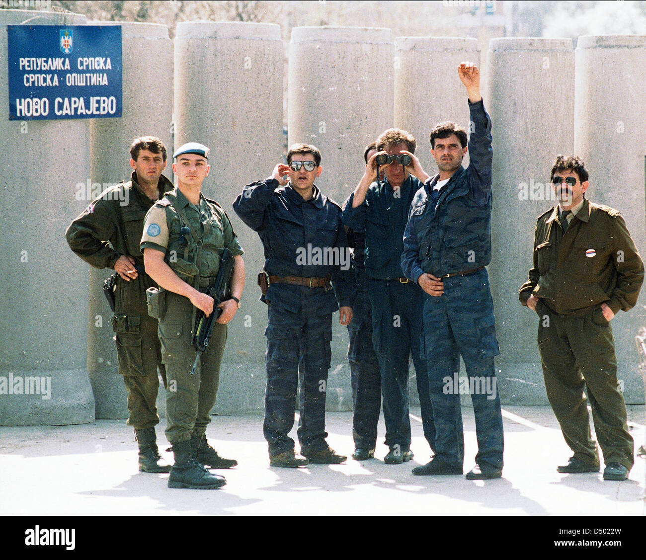 Bosnian Serb paramilitaries wave at reporters after erecting a concrete wall in front of a French UNPROFOR checkpoint in Sarajevo, Bosnia, on Sunday, April 24, 1994. Stock Photo