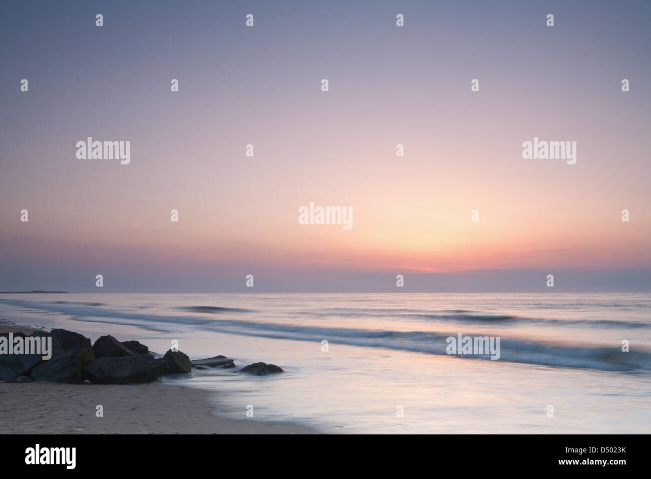 NORFOLK; BRANCASTER; BEACH; SUNSET; SEA; WAVES; ROCKS; SAND Stock Photo