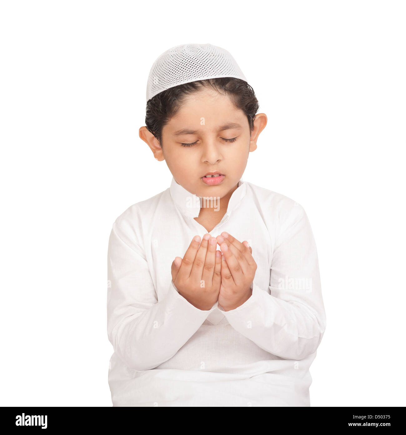 Muslim boy praying Stock Photo