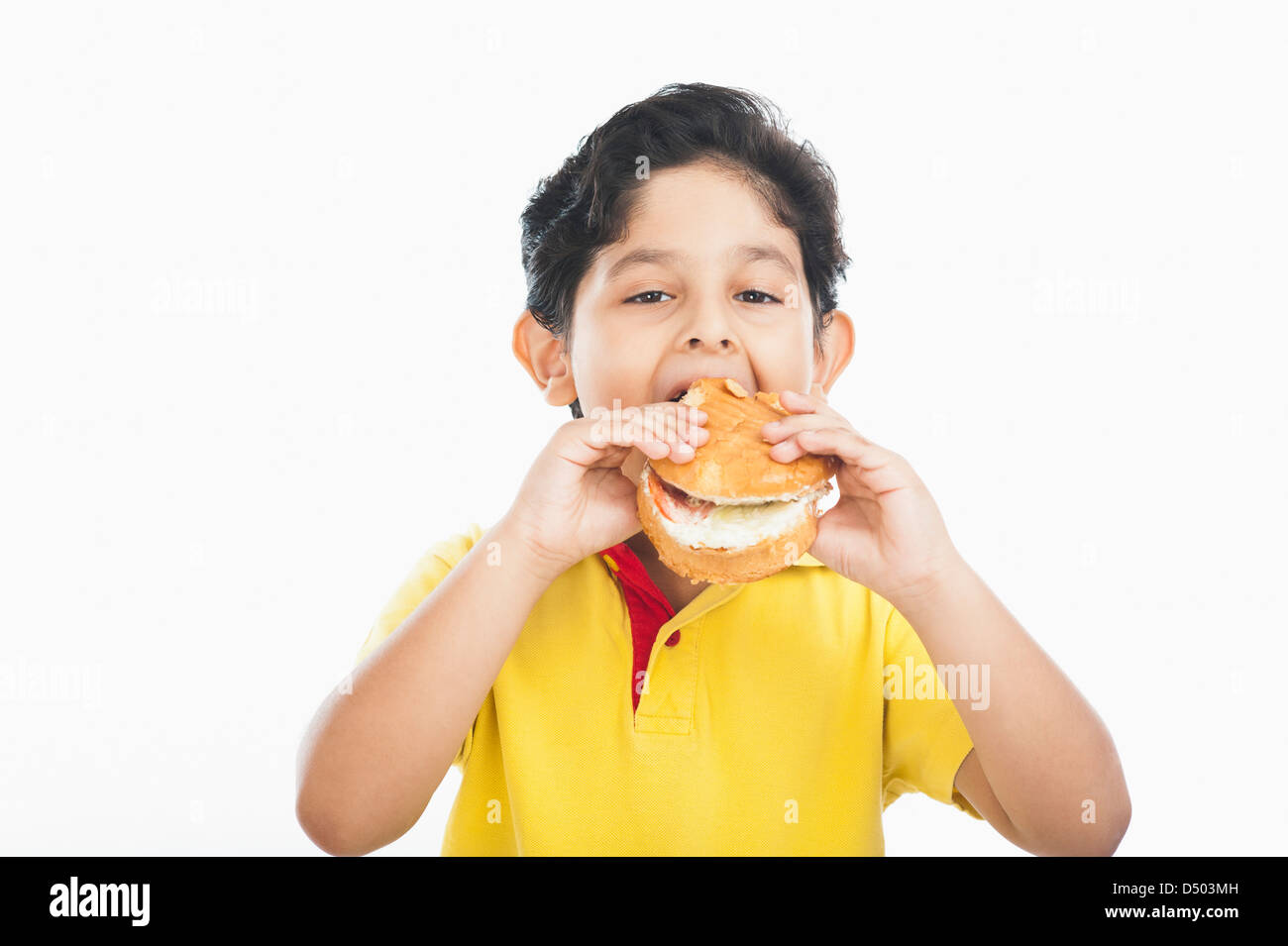 Boy eating a burger Stock Photo