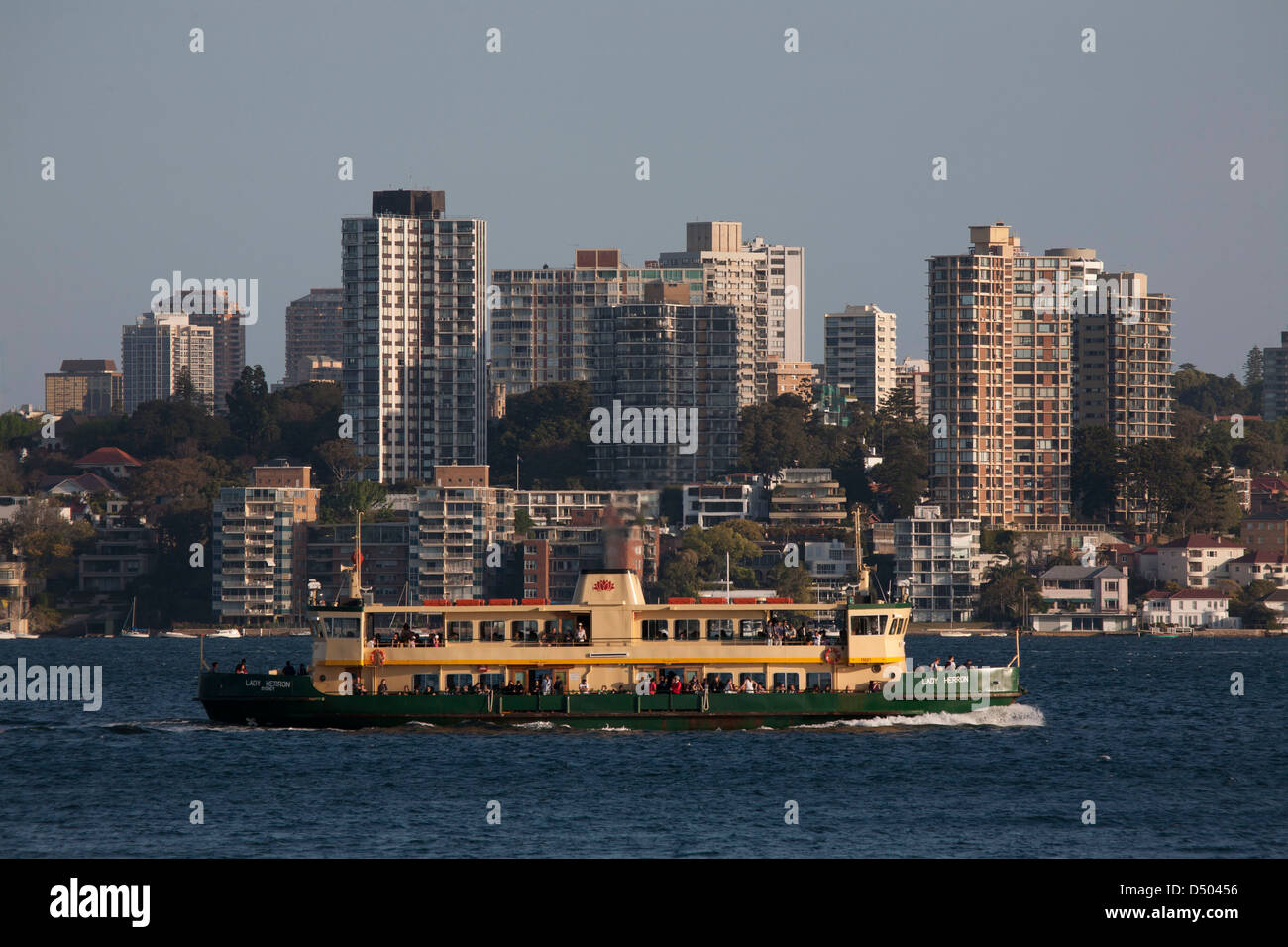 Sydney Harbour Ferry Lady Herron passing residential apartments on