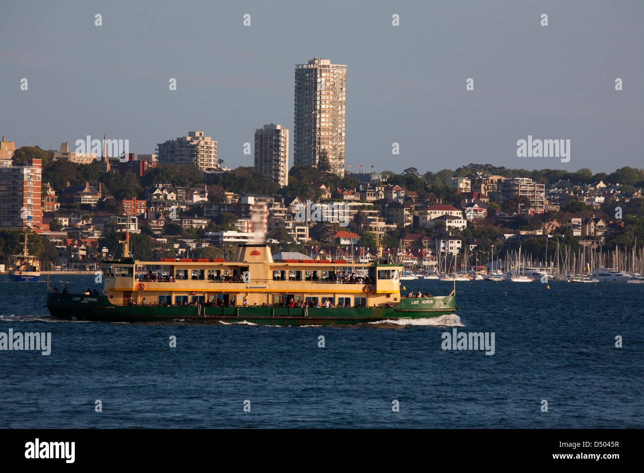 Sydney Harbour Ferry Lady Herron passing residential apartments on