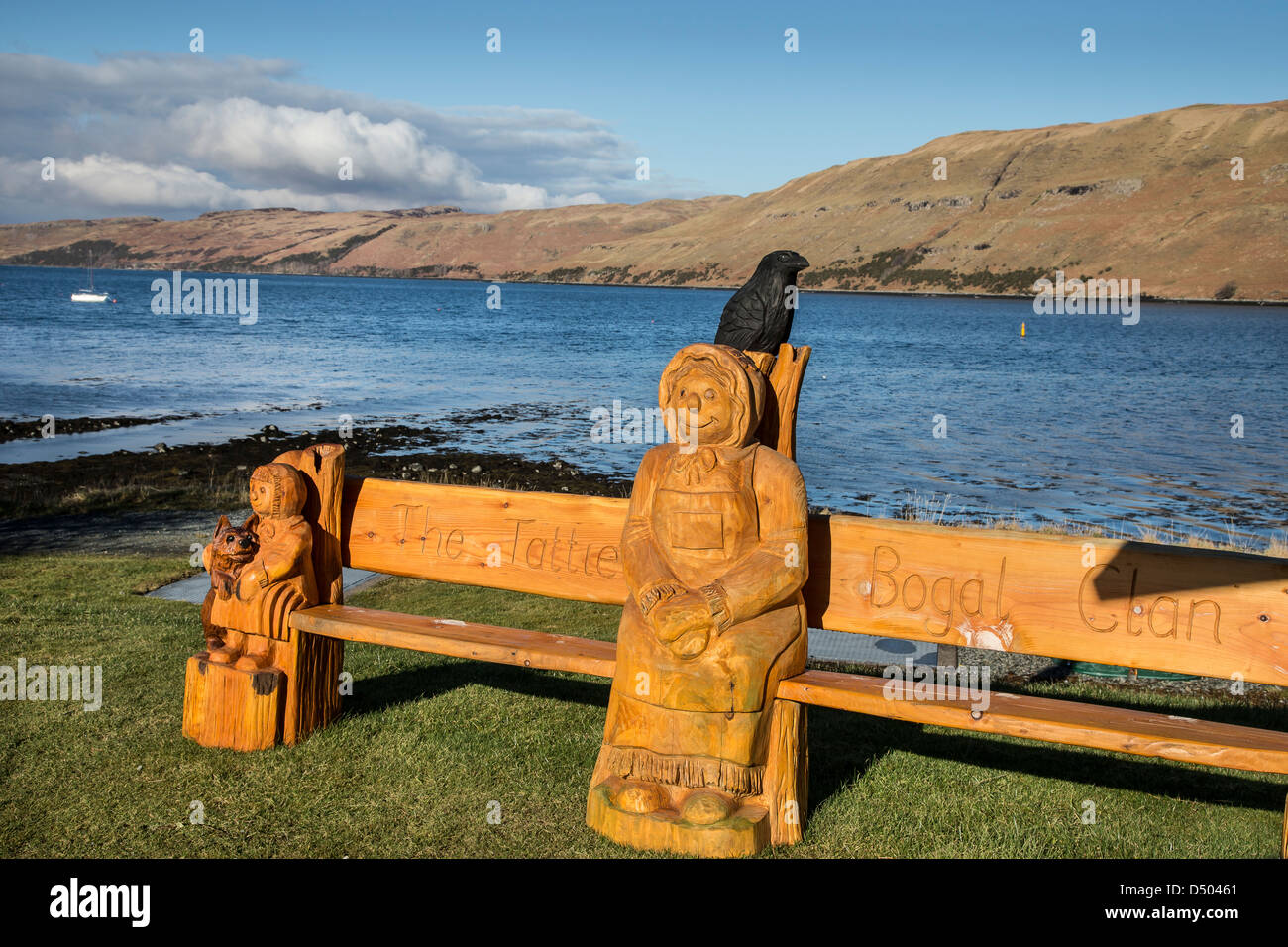 Carved wooden seat & figures at Carbost isle of Skye Stock Photo