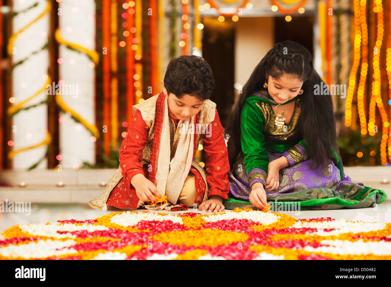 Children making rangoli on Diwali Stock Photo