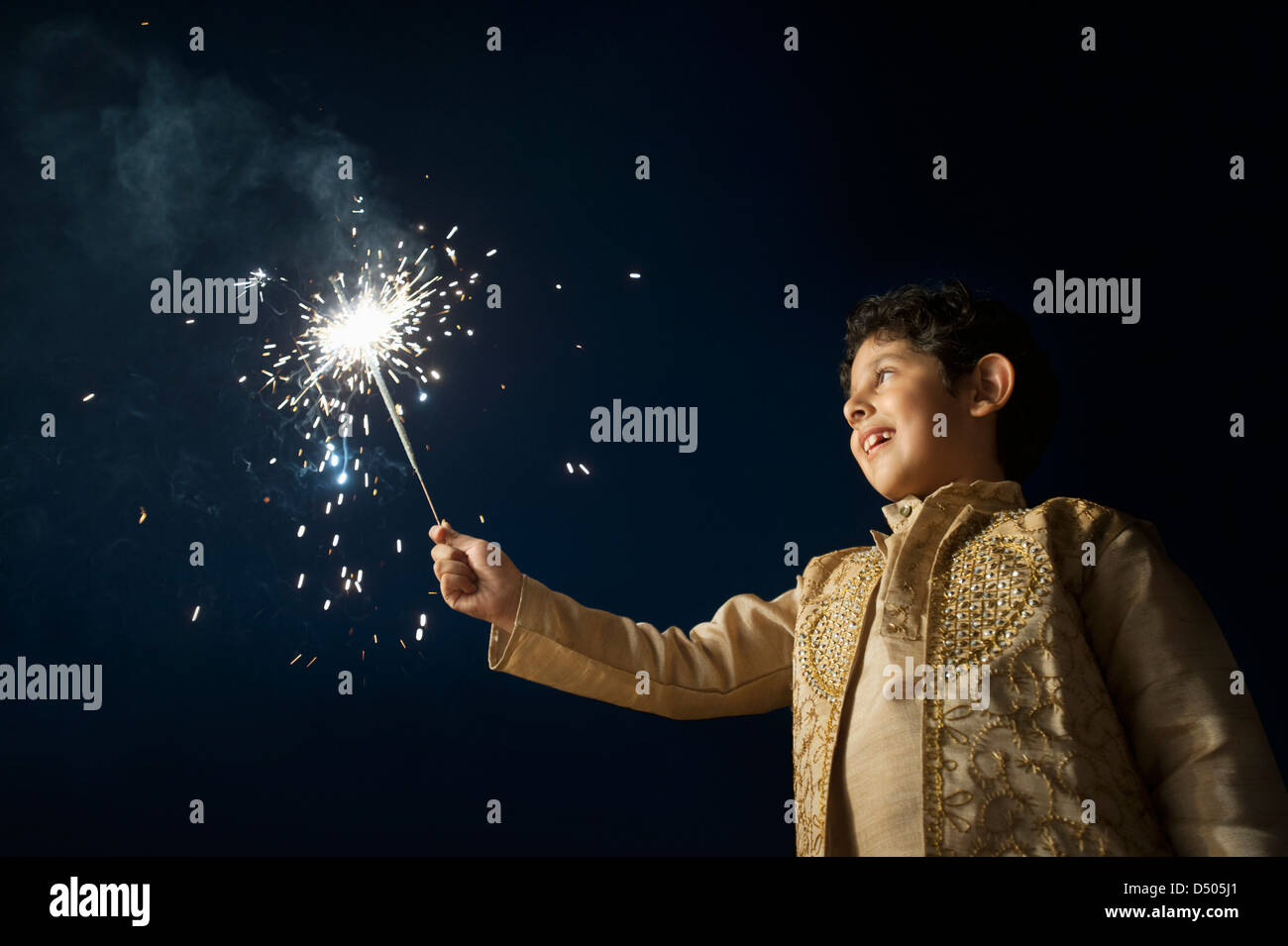 Boy burning fire crackers on Diwali Stock Photo Alamy