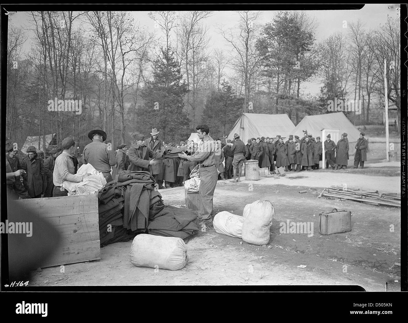 Issuing cots and blankets to new replacements just arrived from New York at CCC Camp, TVA #23, November 1933 Stock Photo