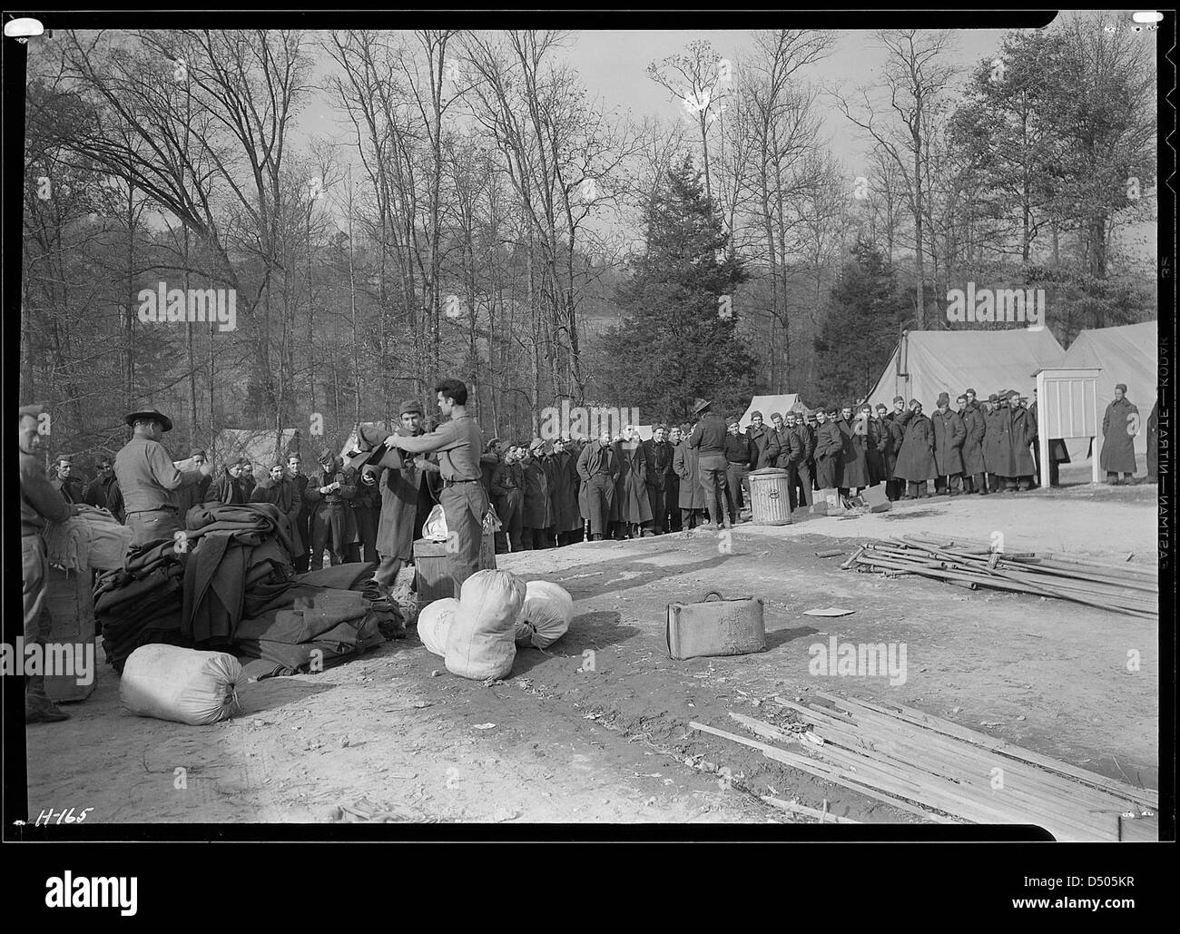 Another view of the issuing of equipment to the new arrivals at CCC Camp, TVA #23, between Walker's Ford and Lone Mountain, Tennessee, November 1933 Stock Photo