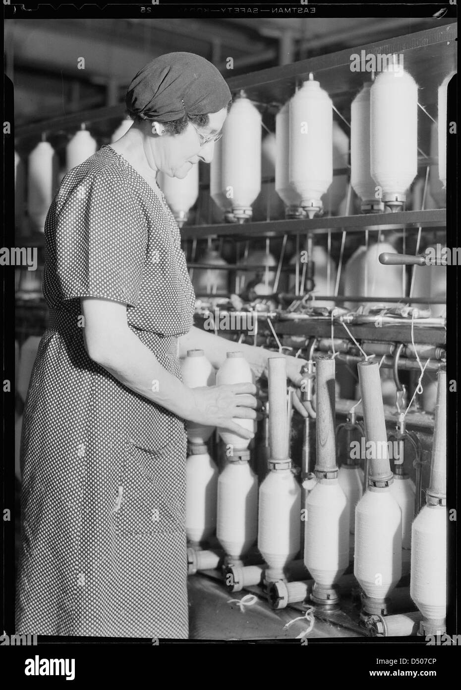Textiles. Pacific Mills. Roving, a drawing-out process. (Front of machine), April 1937 Stock Photo