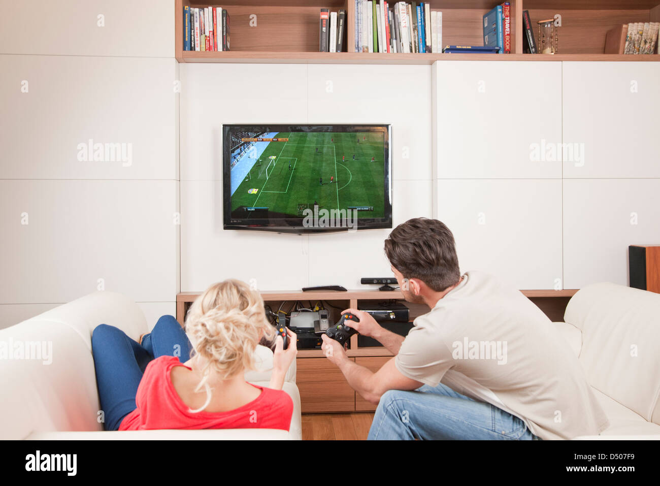 Couple playing console game Stock Photo