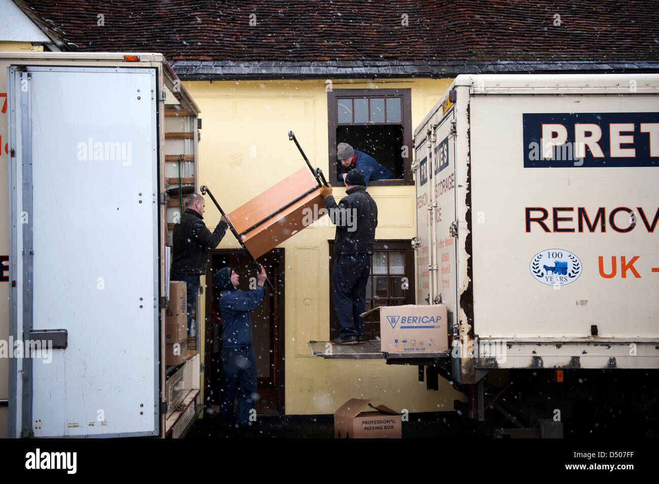 Moving Home. Removal men move contents of photographers house, Thaxted