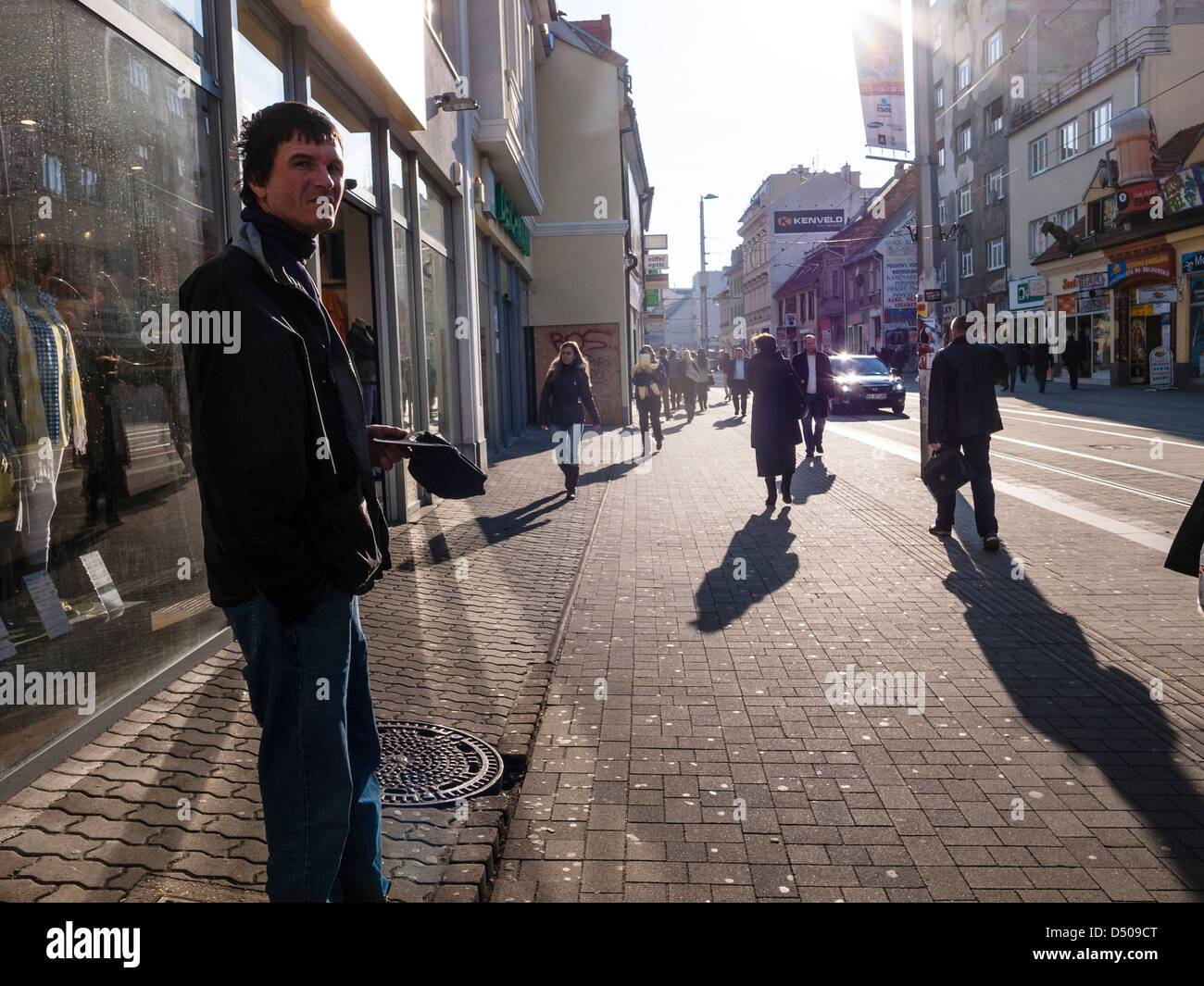 a beggar on obchodna street in sunny spring day Stock Photo