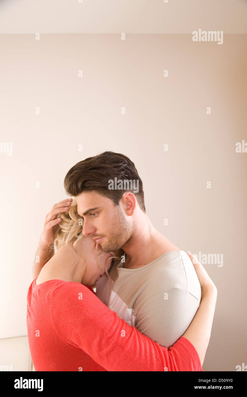 Couple hugging sad hi-res stock photography and images - Alamy
