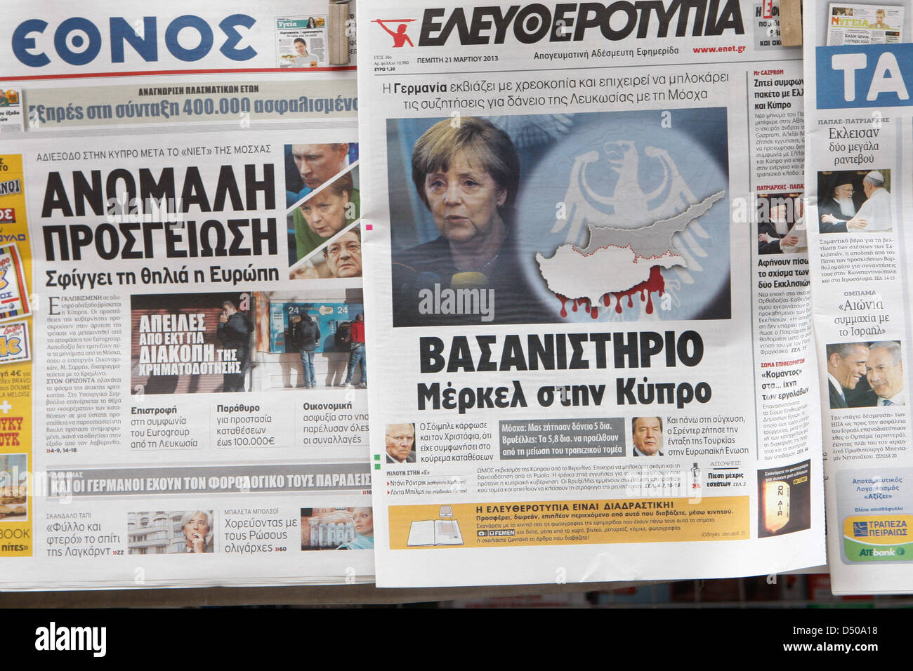 Athens, Greece. 21st March 2013. Man reads Greek newspaper in the
