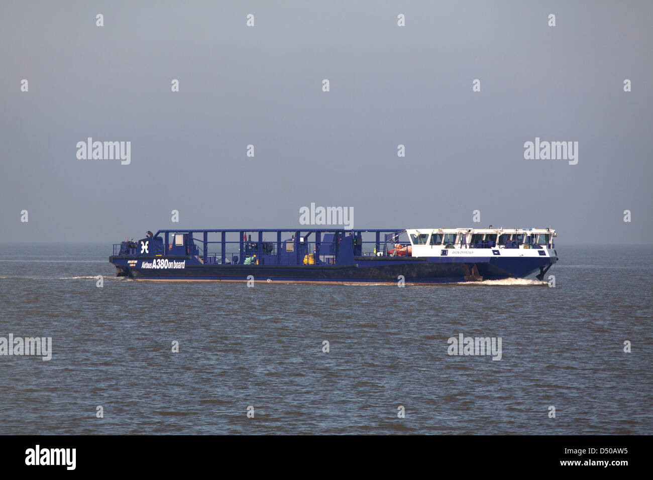 The Wales Coastal Path in North Wales. The Afon Dyfrdwy Airbus A380 wing transport vessel on the River Dee. Stock Photo