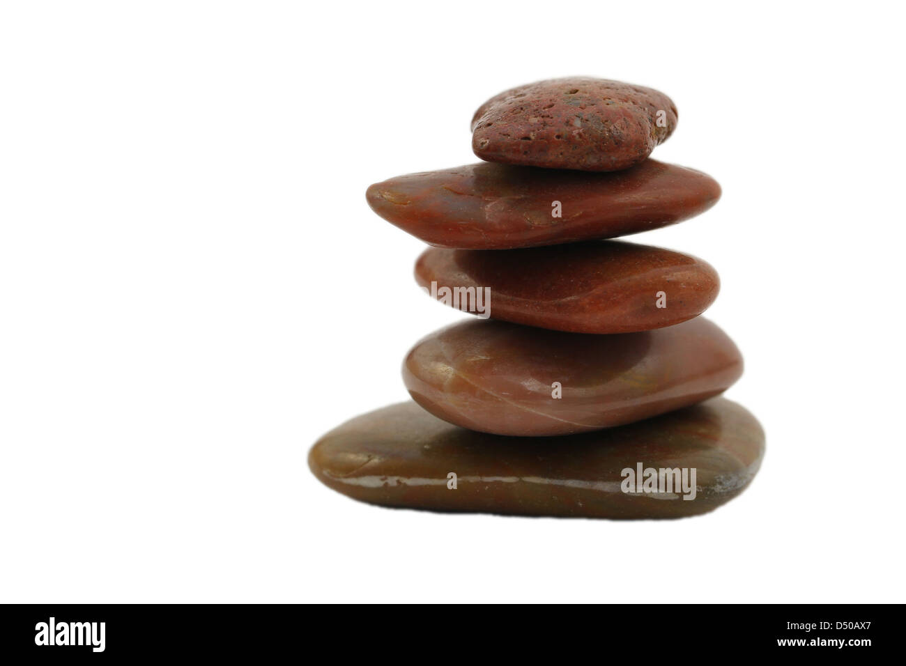 Stack of red, flat stones isolated on white Stock Photo