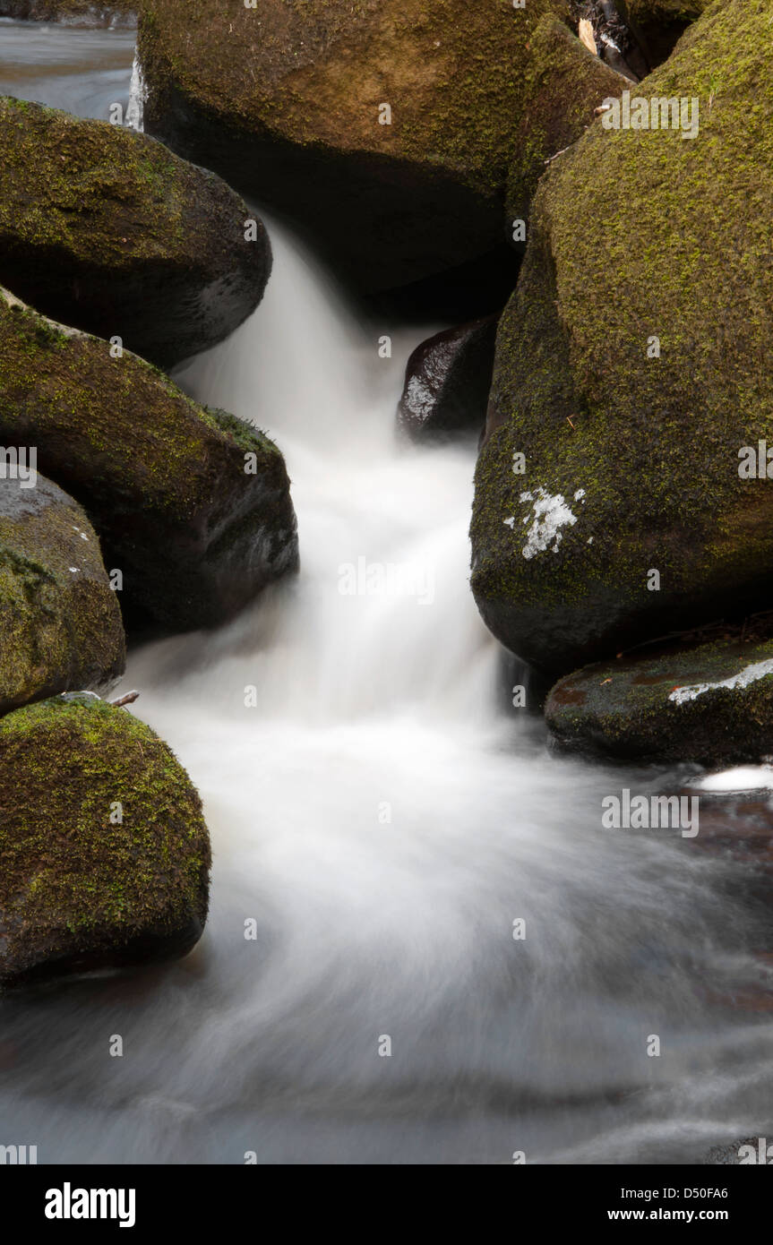 Water flowing down a river in the Peak District National Park Stock Photo