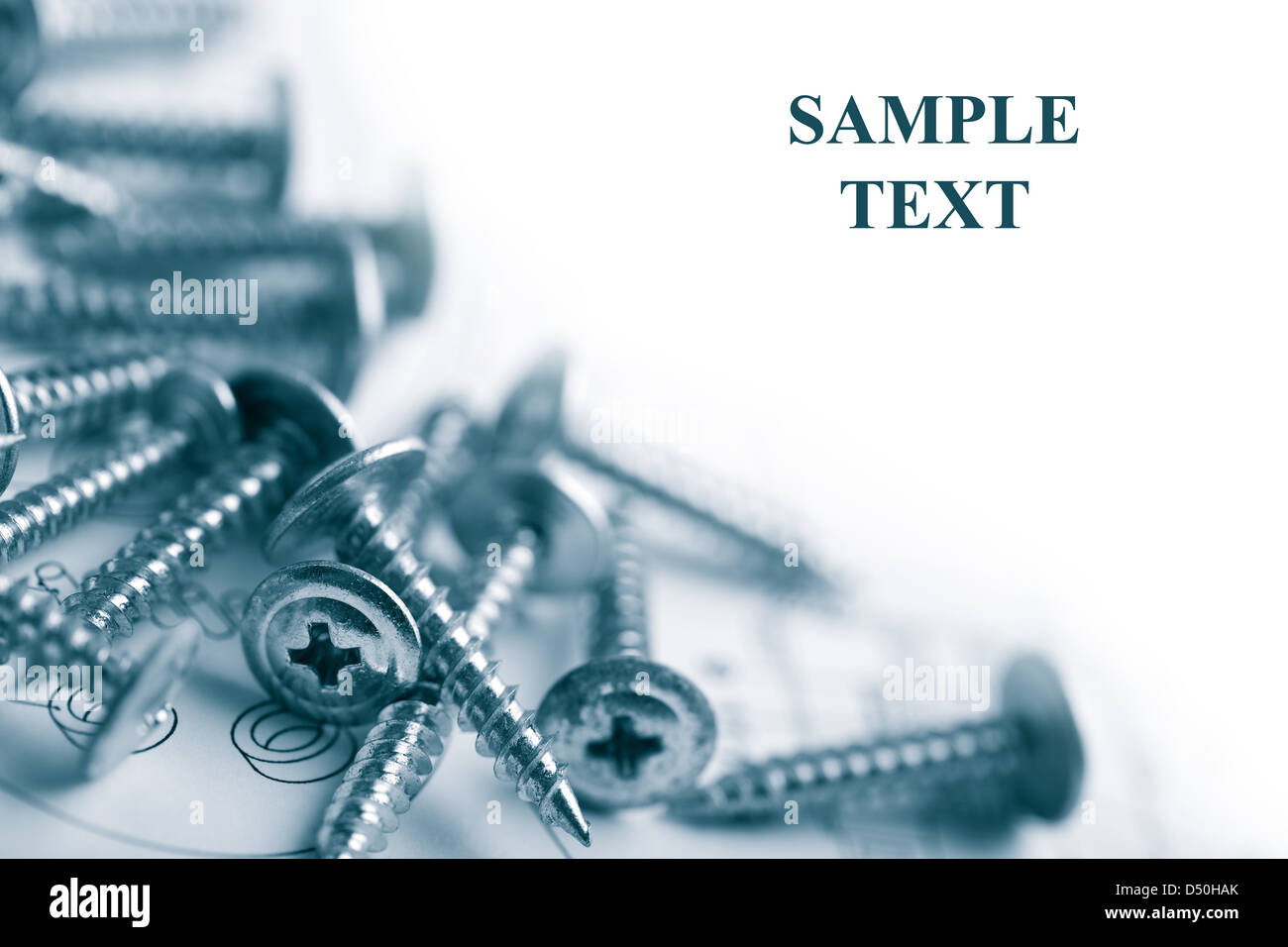metal screws over technical drawing isolated Stock Photo