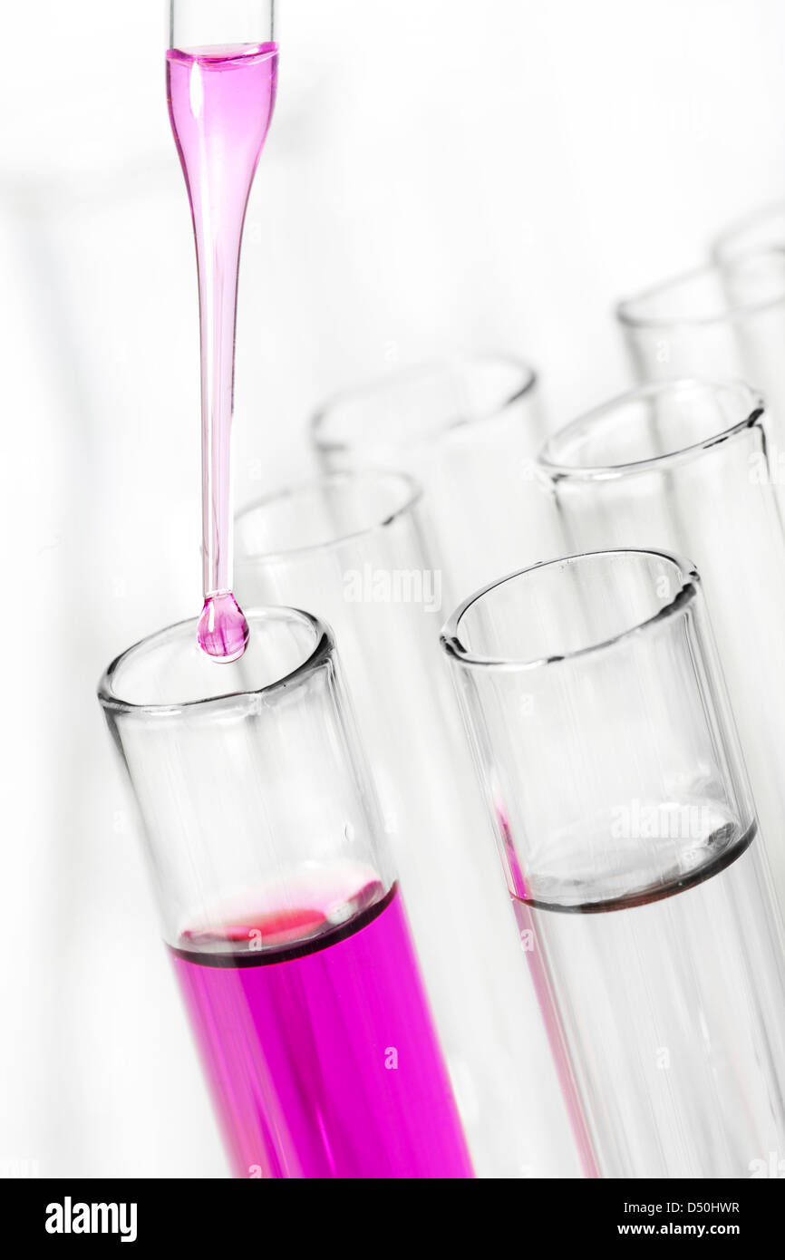 liquid dripping from pipette into test tube Stock Photo