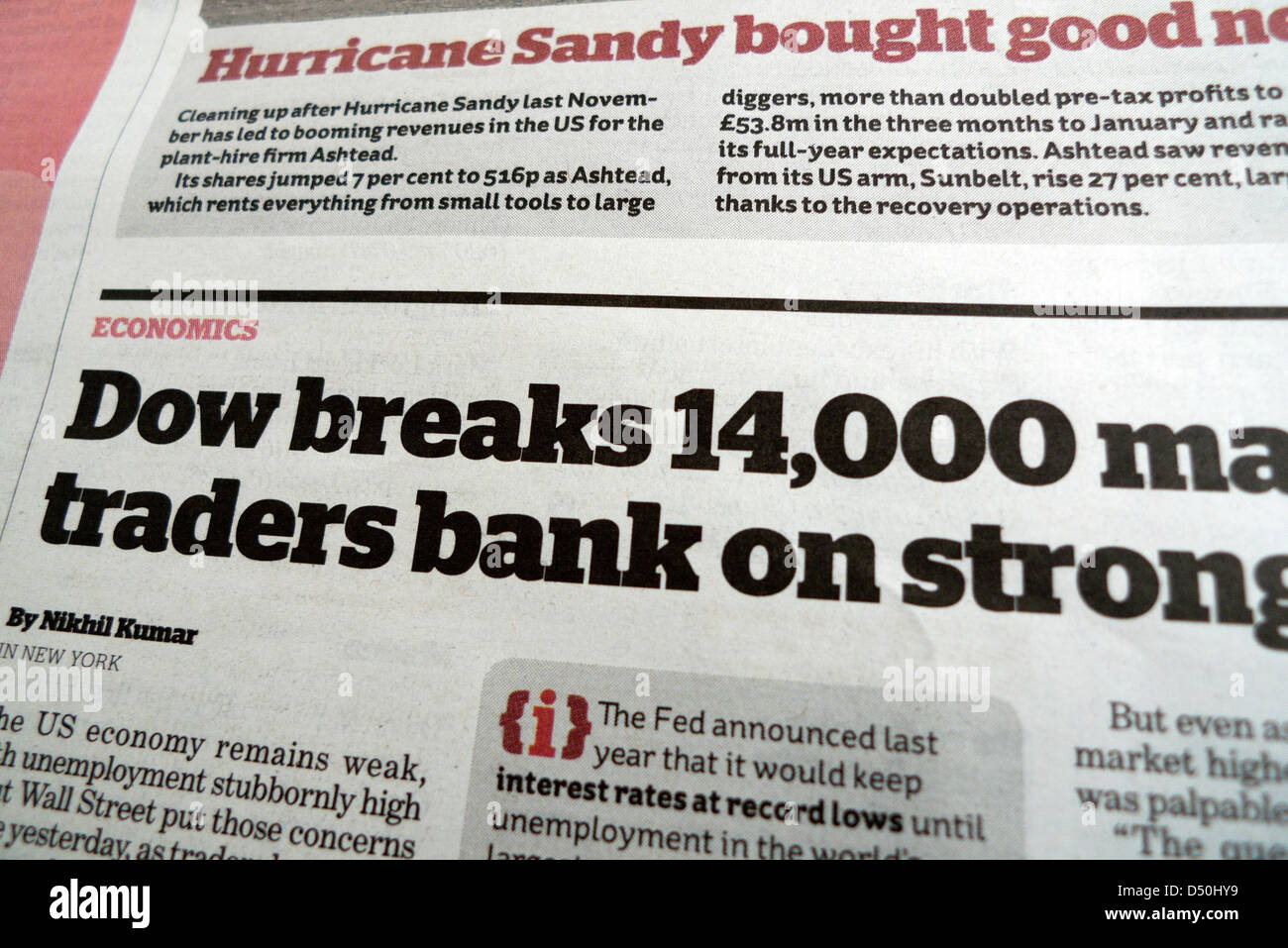 i British newspaper Financial stock market headline "Dow breaks 14,000" in February 2013 Stock