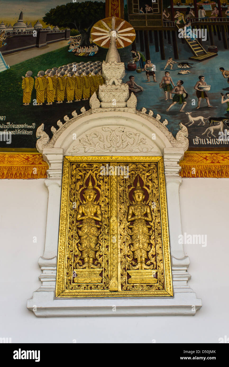 Golden Ornament wooden window of Thai temple in Lamphun, Thailand Stock Photo