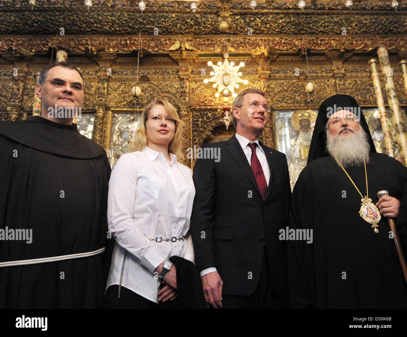 German President Christian Wulff (2-R), his daughter Annalena, Greek-Orthodox Bishop Theoflakes (R) and the head of the Franciscan parish Father Marwan Daadas (L) walk through the Church of the Nativity in Bethlehem, Palestinian Territories, 30 November 2010. The four-day state visit of German President Wulff will end today with his visit to the Palestinian Territories. Photo: RAIN Stock Photo