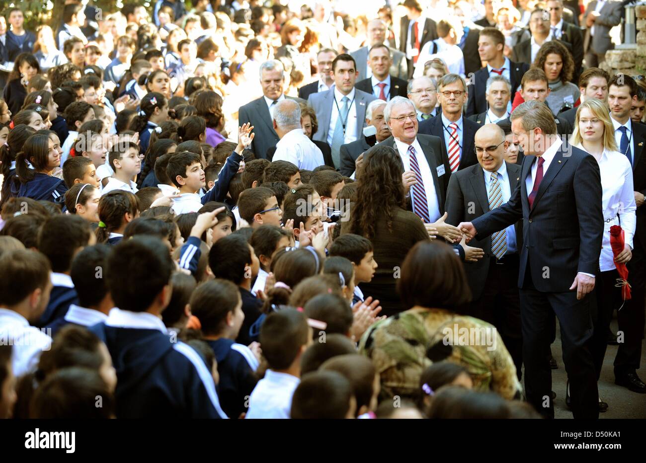 German President Christian Wulff (R) and his daughter Annalena visit the Talitha Kumi Lutheran Secondary School in Bethlehem, Palestinian Territories, 30 November 2010. The four-day state visit of German President Wulff will end today with his visit to the Palestinian Territories. Photo: RAINER JENSEN Stock Photo