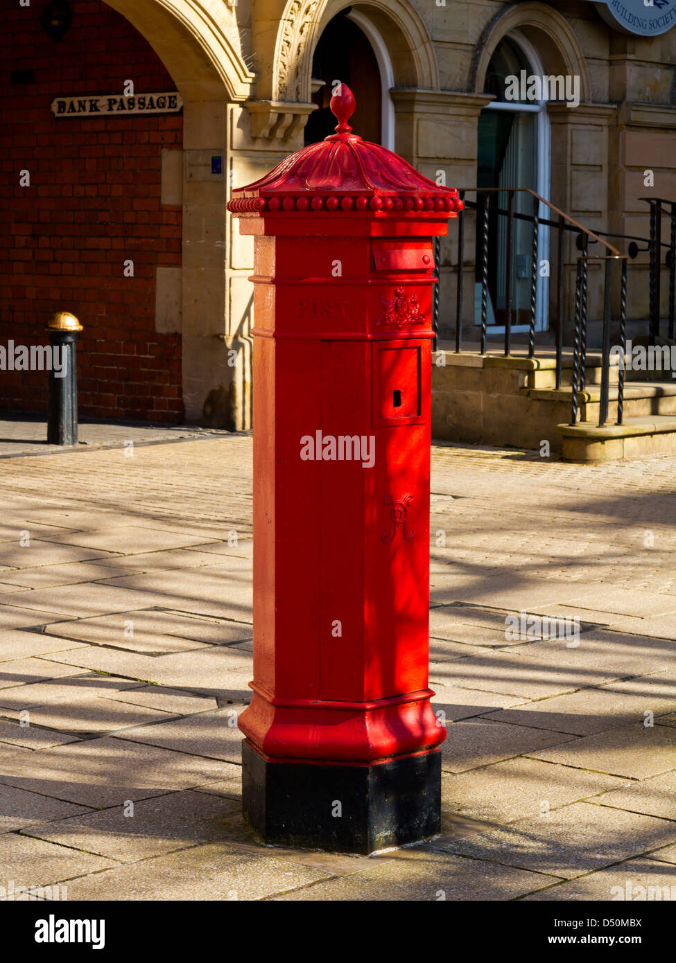 Traditional red painted Victorian letter box in Market Square Stafford Staffordshire UK Stock Photo