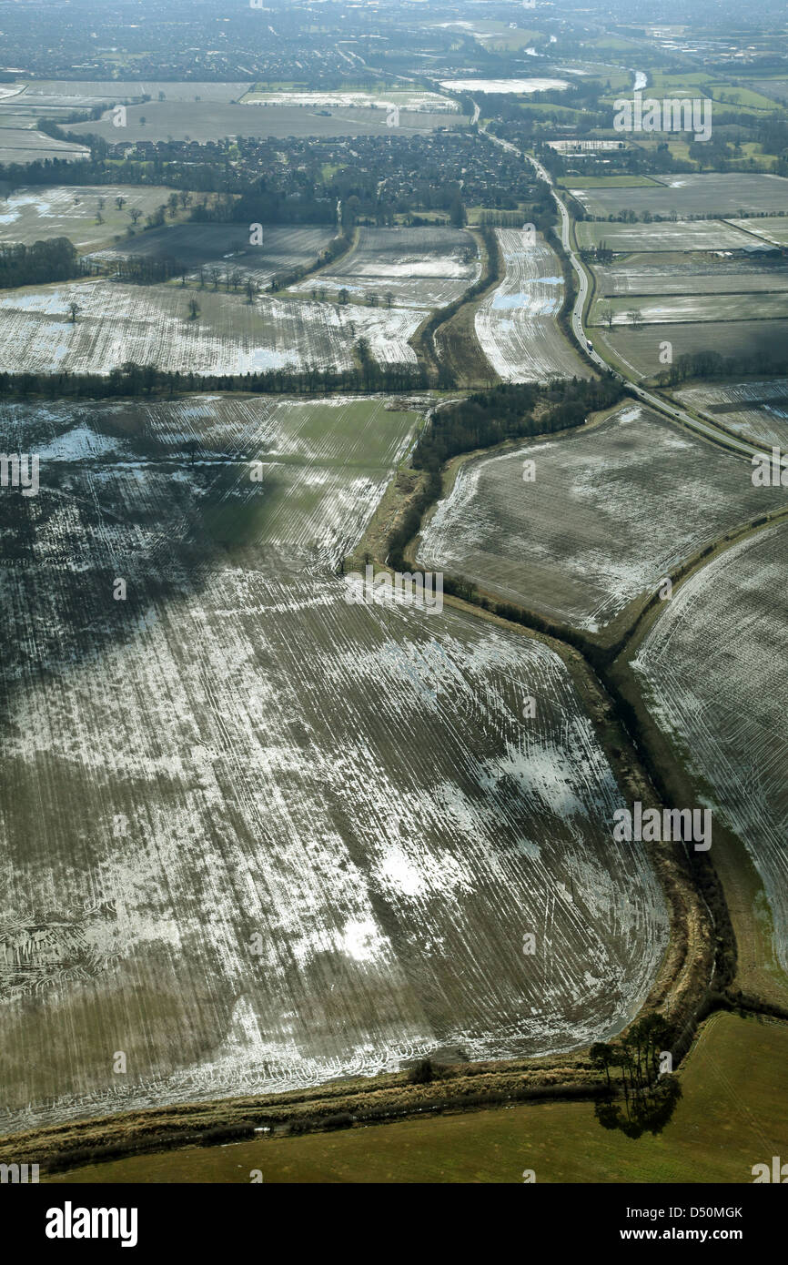 aerial view of wet and sodden agricultural fields, looking into sun it shows wet they are Stock Photo