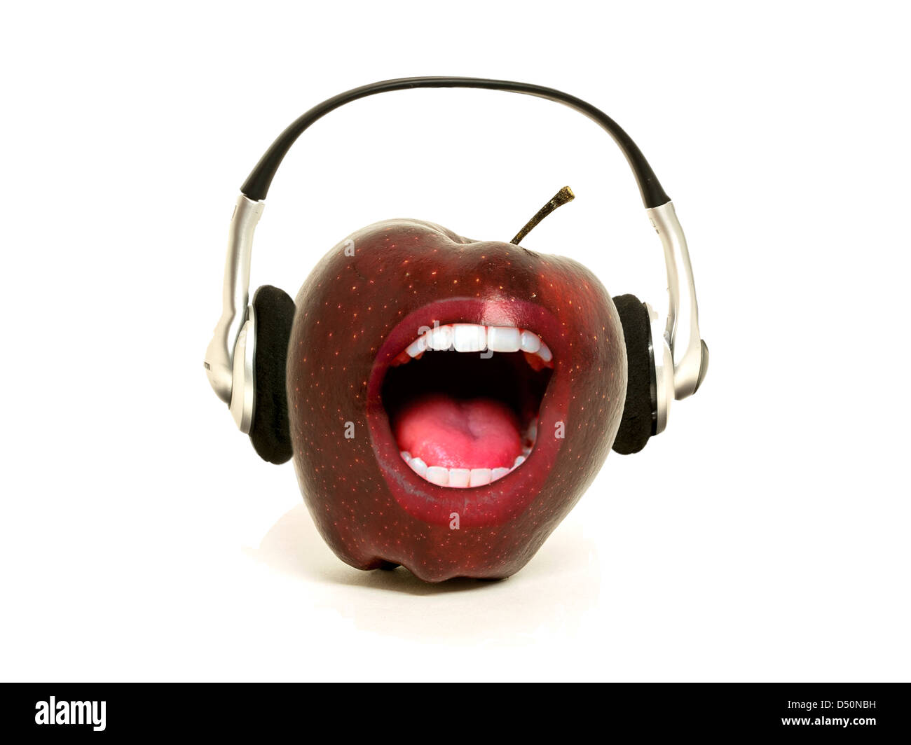 Singing red apple wearing headphones on a white background Stock Photo -  Alamy
