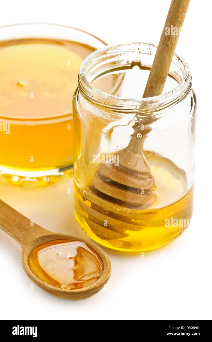 honey in glass jar isolated Stock Photo Alamy