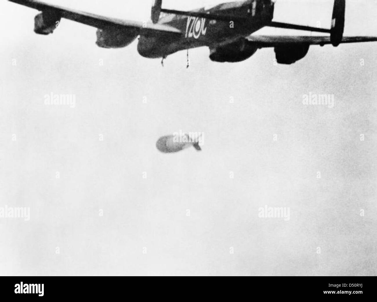 22,000lb 'Grand Slam' falls away from an Avro Lancaster of No. 617 Squadron RAF during an attack on the viaduct at Arnsberg, Ge Stock Photo