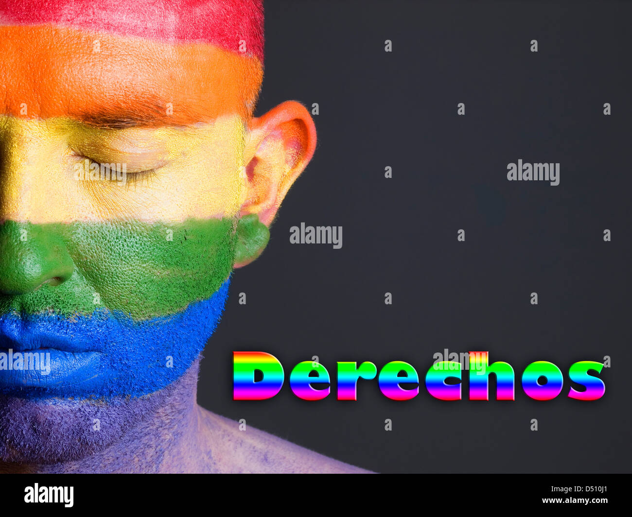 Hombre con la bandera gay pintada en la cara y con los ojos cerrados. La palabra 'derechos' esta escrita en un lado. Stock Photo