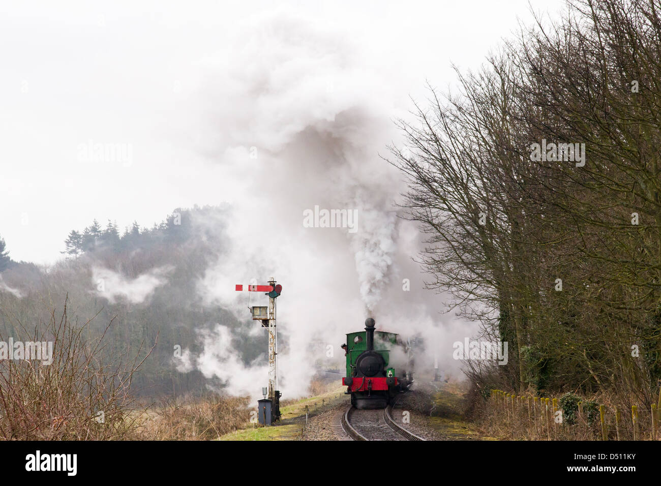 A steam locomotive pulling a passenger train on the North Norfolk Railway, England Stock Photo