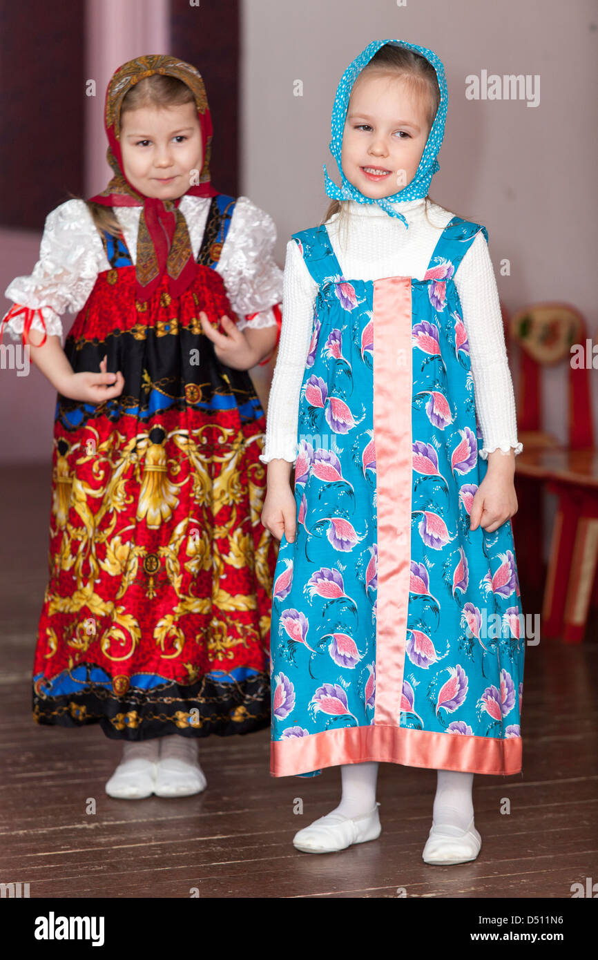Cute girls in Russian traditional clothes in kindergarten perfoming on ...