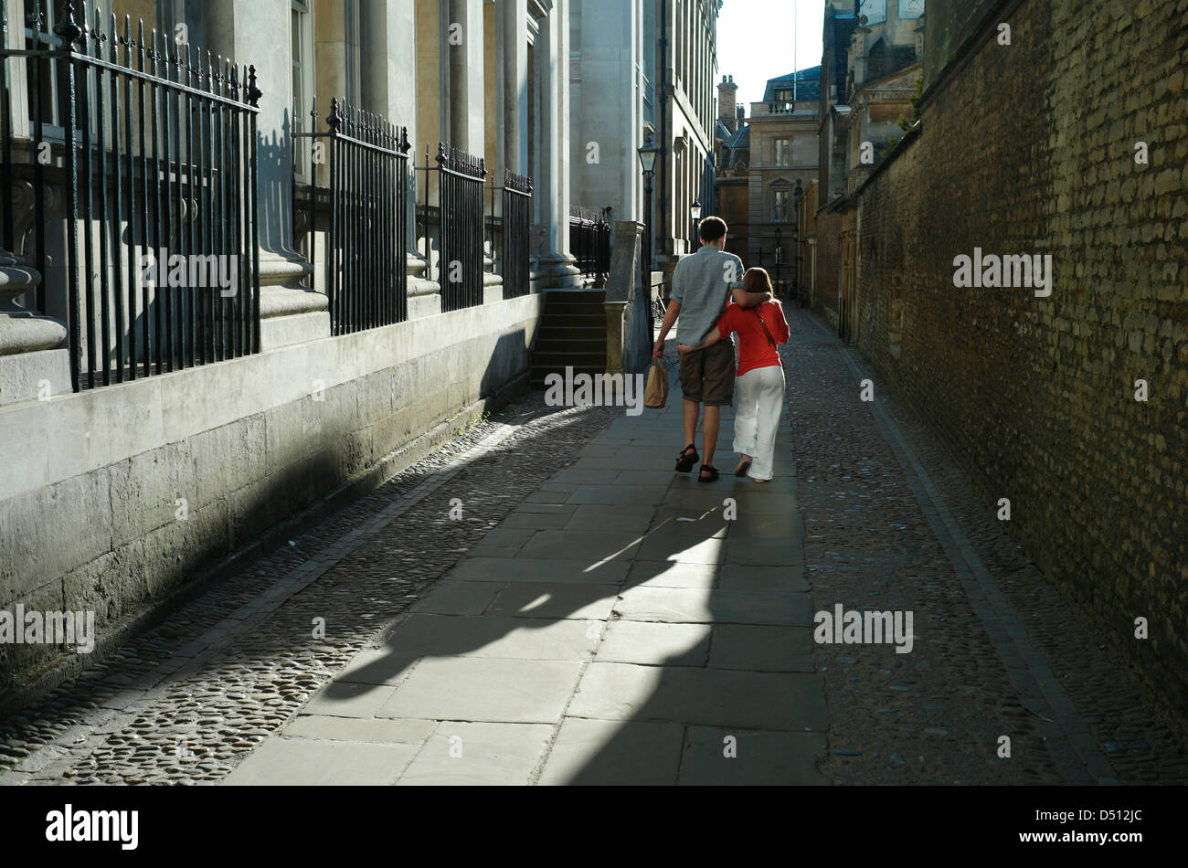 Cambridge visitors, City Centre,Cambridge,England May 2010. Young couple explore the many the old pathways around the City. Stock Photo