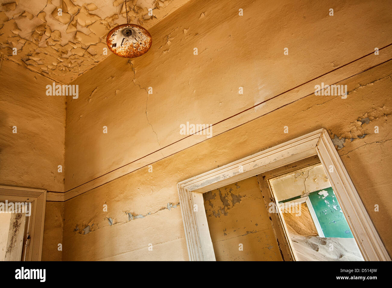 Sand Colored Bladdering Paint On Walls Of Deserted House In