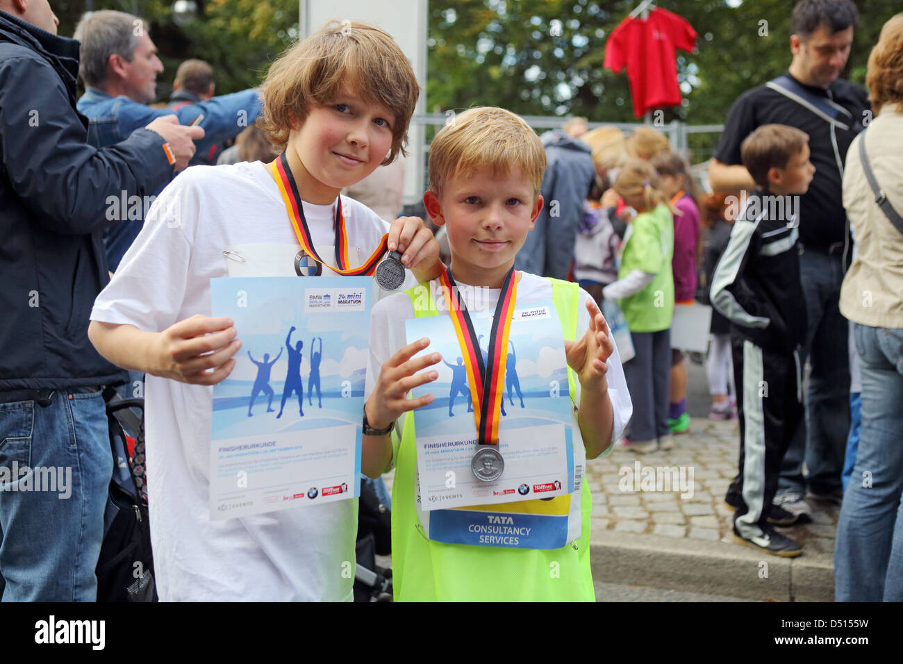 Berlin, Germany, boys proudly display their certificates and medals for