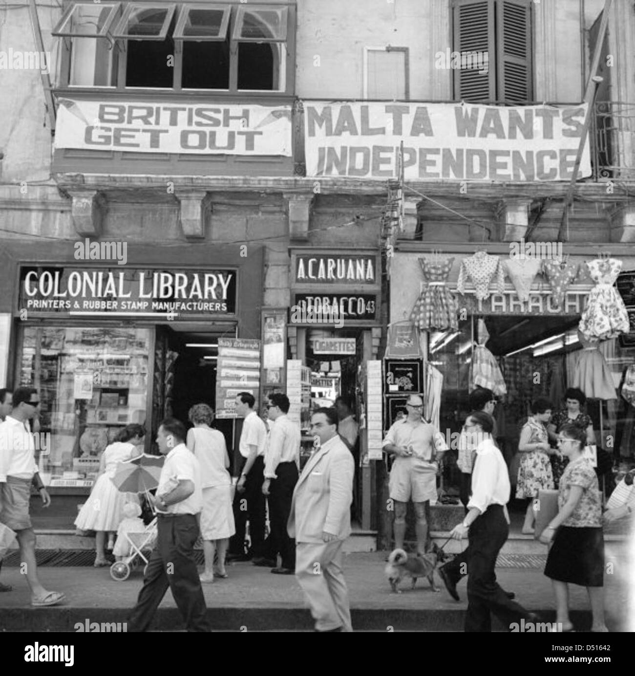 A view of shops with anti-British and pro-Independence signs, possibly on Kings Street, Valetta, Malta Stock Photo
