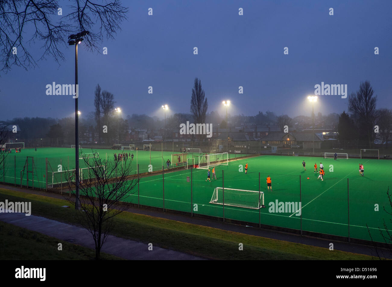 Sports pitches illuminated at night in the grounds if University of Birmingham. Stock Photo