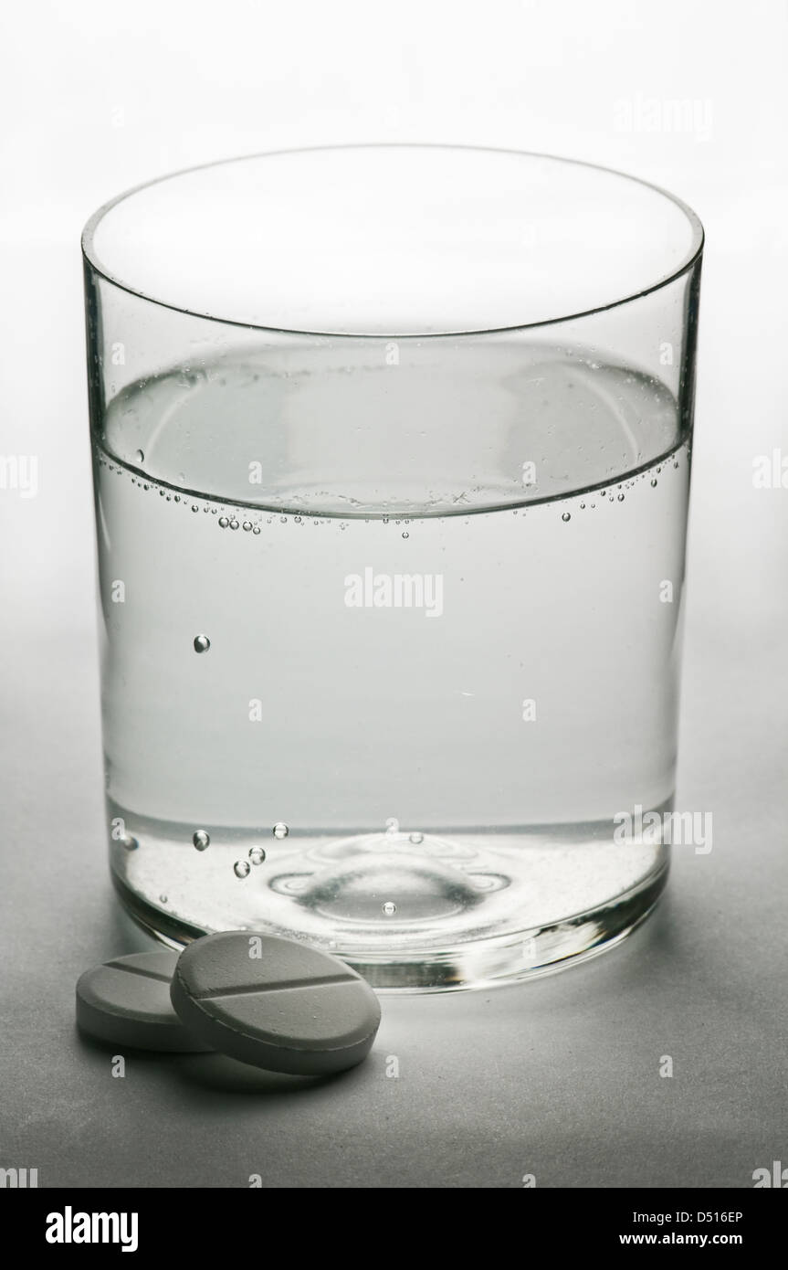 aspirin and glass of water Stock Photo