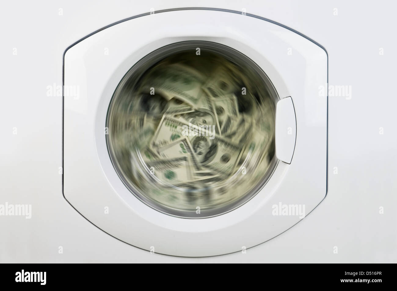 money in washing machine close up Stock Photo