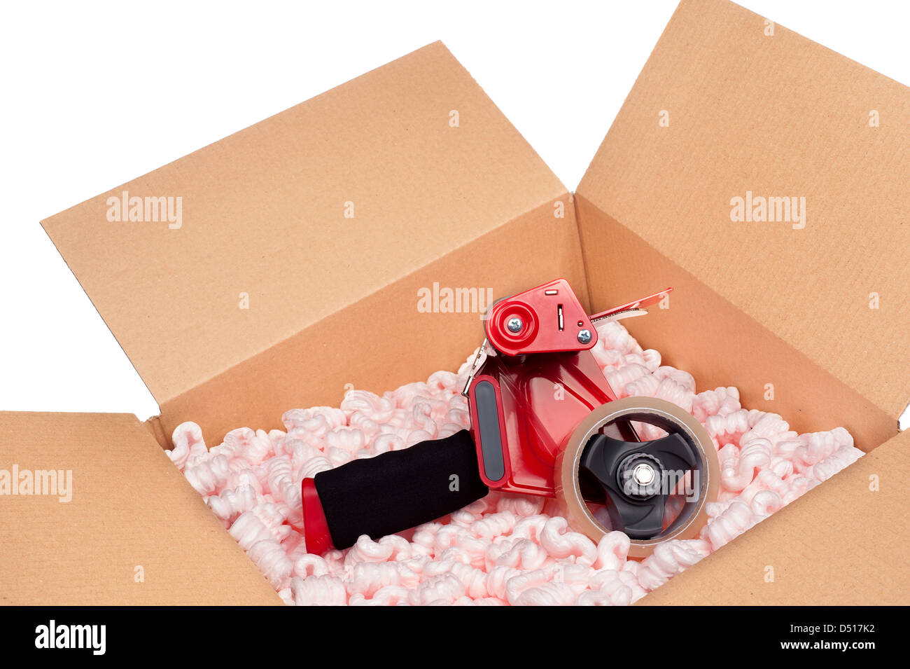 A box full of protective packaging peanuts and a tape dispenser ready