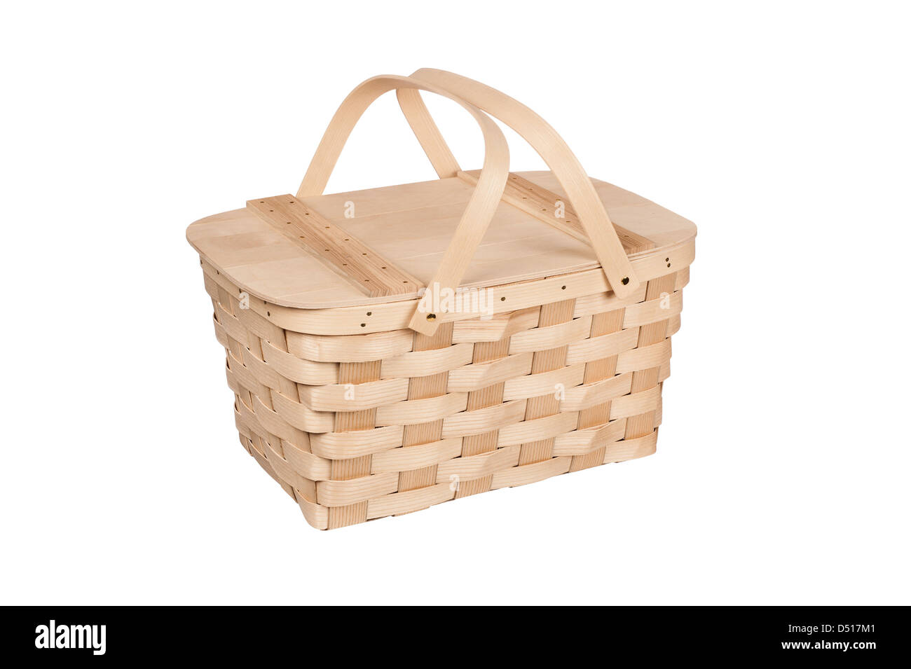 A new wicker and wood picnic basket with lid and handles isolated on white. Stock Photo