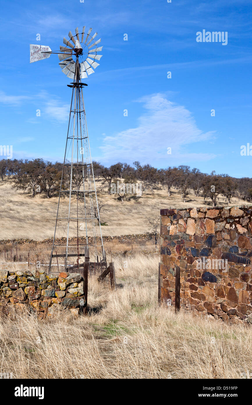 Windmill and rock wall at Telegraph City in Calaveras County, California. Stock Photo
