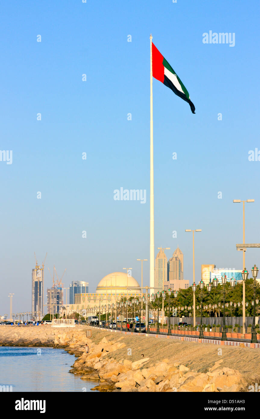 Flag Pole with the UAE National Flag on the Abu Dhabi Breakwater Stock