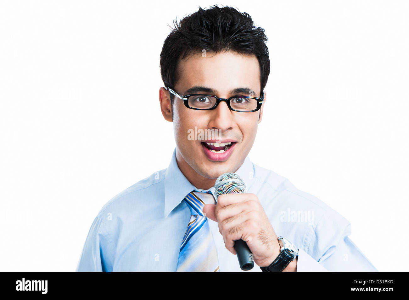 Businessman giving speech into a microphone Stock Photo Alamy