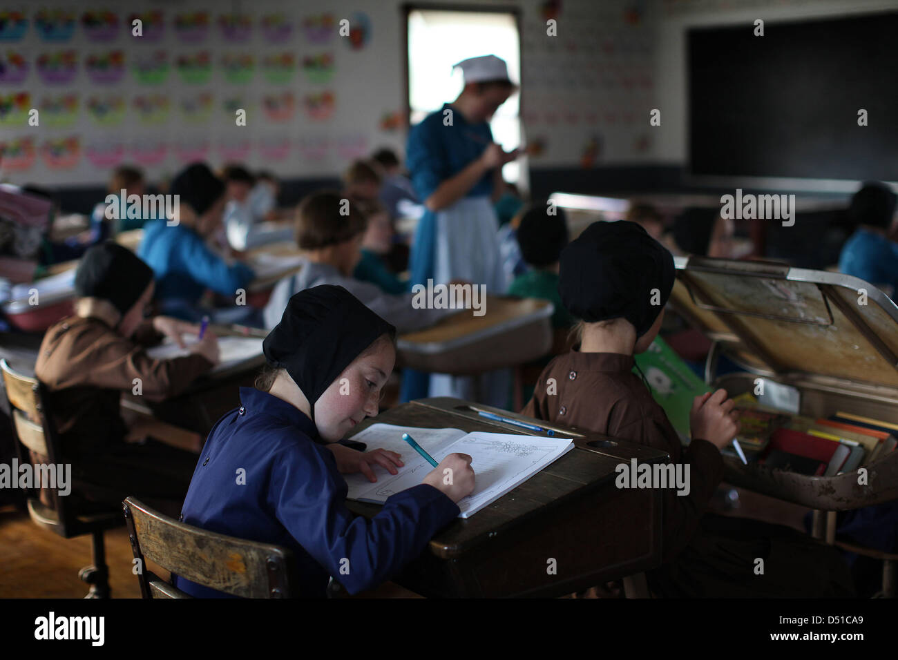 Dec 05, 2012 Bergholz, Ohio, U.S. Amish children work on a spelling lesson at thier
