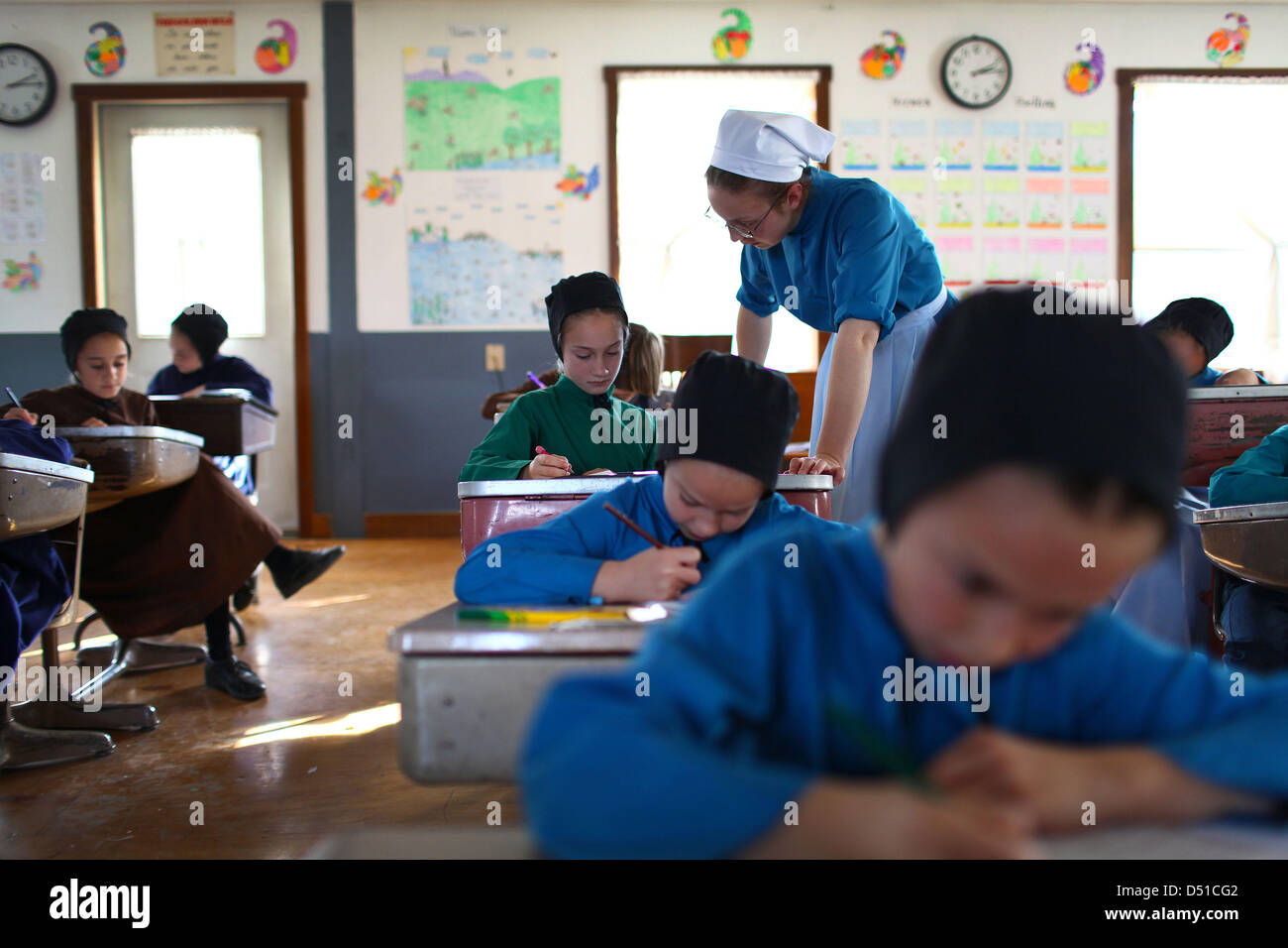 Dec 05, 2012 Bergholz, Ohio, U.S. An amish girl gets help from her teacher during a